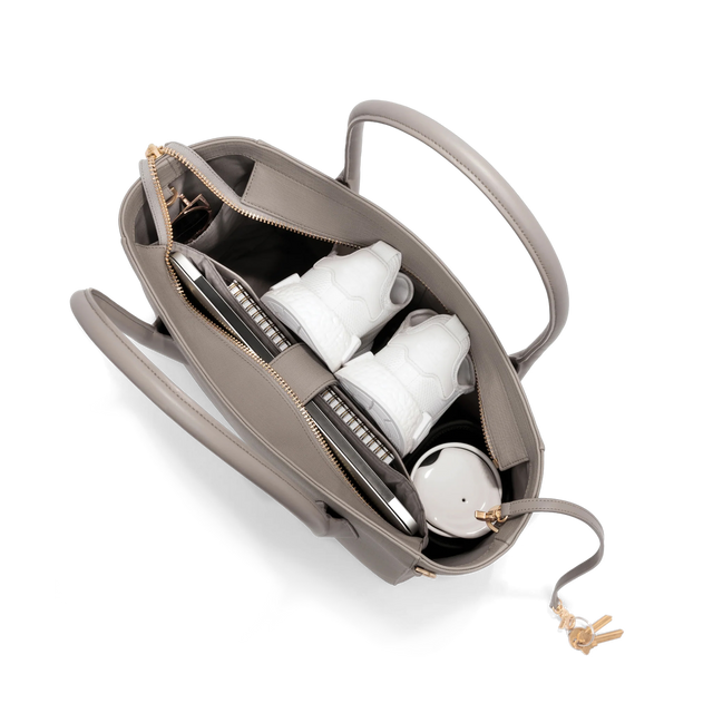 hover - Dagne Dover Legend Signature Leather Tote in beige seen from above, revealing 2 slip pockets, the neoprene bottle holder, and large interior zipper pocket.