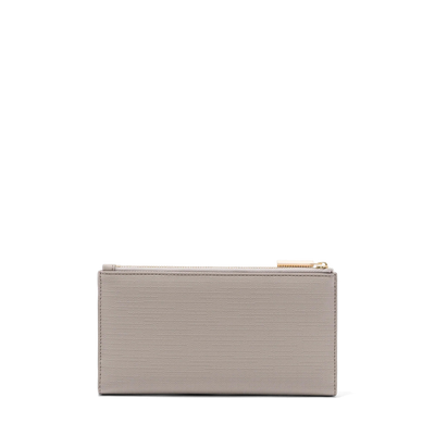 Dagne Dover Slim Wallet in beige seen from the back.