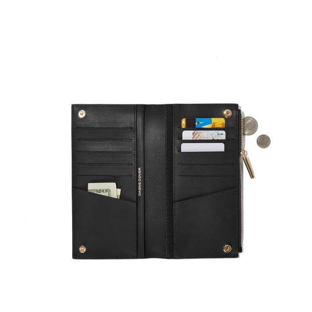 hover - Dagne Dover Slim Wallet in black unclasped, revealing ten card slots, two additional slip pockets, and four cash pockets.