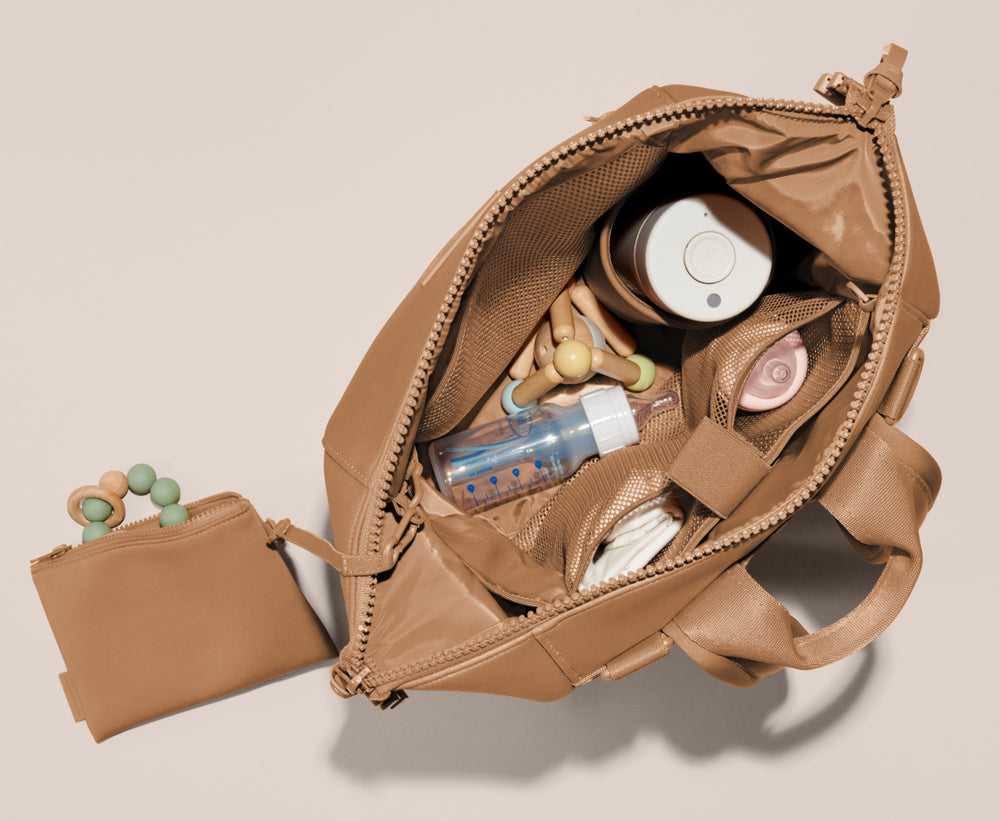 Dagne Dover - SURPRISE! It's a DAGNE DOVER DIAPER BAG. We're so excited  to bring you our newest bundle of joy, the Baby Capsule. Launching soon,  stay tuned for more details! 🧸